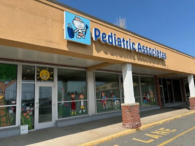 The Canton office storefront with the Pediatric Associates sign and children's window paintings